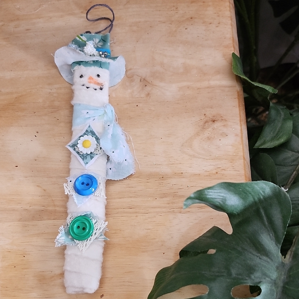 Handcrafted Snowman Ornament with Blue and Green Accents